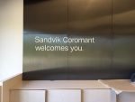 Sandik Coromant welcomes you - text on wall